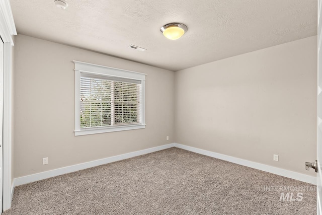 13991 W Milford Dr, Boise, ID 83713 - carpeted empty room featuring a textured ceiling, baseboards, and a smoke detector