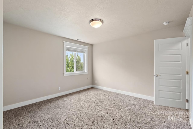 13991 W Milford Dr, Boise, ID 83713 - carpeted spare room featuring baseboards, a smoke detector, and a textured ceiling