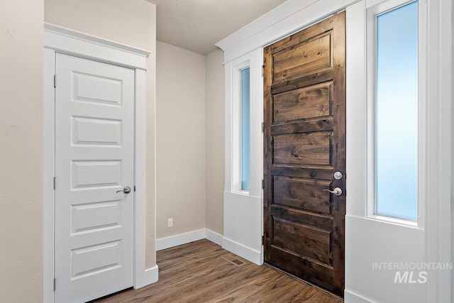 13991 W Milford Dr, Boise, ID 83713 - foyer entrance featuring wood finished floors, baseboards, and healthy amount of natural light