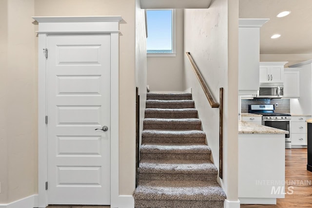 13991 W Milford Dr, Boise, ID 83713 - staircase with recessed lighting and wood finished floors