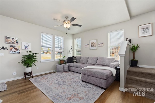 living room featuring hardwood / wood-style flooring and ceiling fan