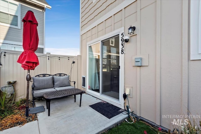 entrance to property with a patio area