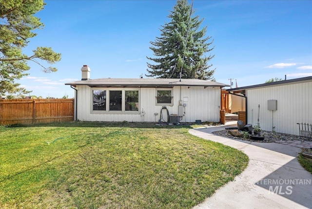167 W Robbins, Twin Falls, ID 83301 - rear view of property featuring a chimney