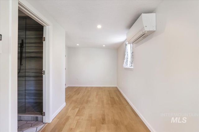 167 W Robbins, Twin Falls, ID 83301 - hall with a wall mounted air conditioner, light wood-type flooring, and recessed lighting