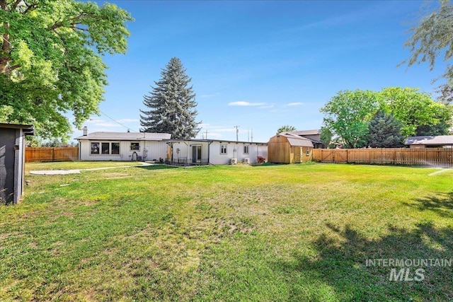 167 W Robbins, Twin Falls, ID 83301 - fenced backyard with a storage shed