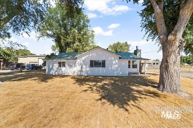 956 SE Hamilton Rd, Mountain Home, ID 83647 - view of front of property with a chimney and metal roof