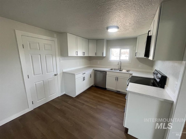956 SE Hamilton Rd, Mountain Home, ID 83647 - kitchen with stainless steel dishwasher, a sink, electric range, dark wood-type flooring, and a textured ceiling