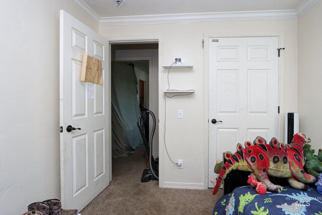 carpeted bedroom featuring crown molding