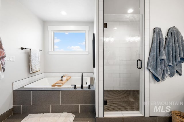 10411 Hazy Glen Dr, Nampa, ID 83687 - full bathroom with a garden tub, a shower stall, and recessed lighting