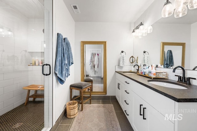 10411 Hazy Glen Dr, Nampa, ID 83687 - bathroom featuring double vanity, tile patterned flooring, and a stall shower