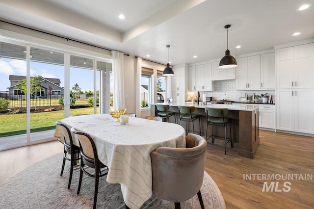 10411 Hazy Glen Dr, Nampa, ID 83687 - dining space featuring wood finished floors and recessed lighting