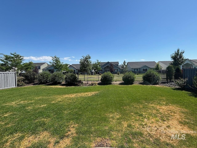 10411 Hazy Glen Dr, Nampa, ID 83687 - fenced backyard featuring a residential view