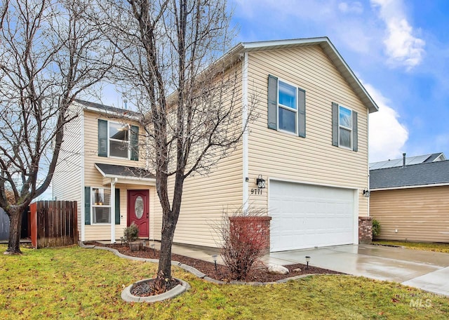 front of property with a front yard and a garage