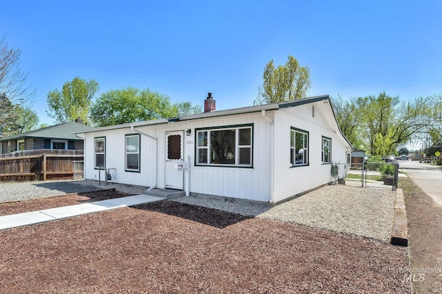 2323 W Lemhi St, Boise, ID 83705 - view of front of property with fence, a chimney, and a gate