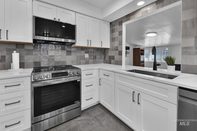 2323 W Lemhi St, Boise, ID 83705 - kitchen featuring a sink, white cabinets, light stone countertops, and stainless steel appliances
