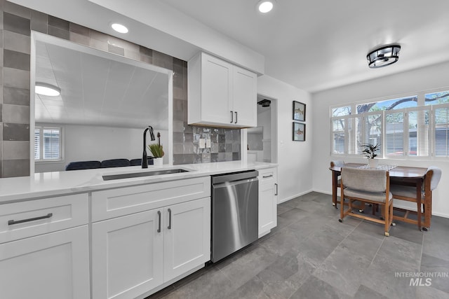 2323 W Lemhi St, Boise, ID 83705 - kitchen with light countertops, a healthy amount of sunlight, a sink, and dishwasher