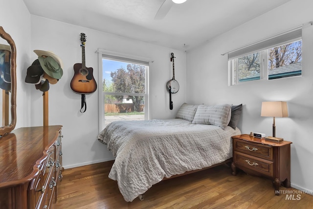 2323 W Lemhi St, Boise, ID 83705 - bedroom with baseboards, ceiling fan, multiple windows, and wood finished floors