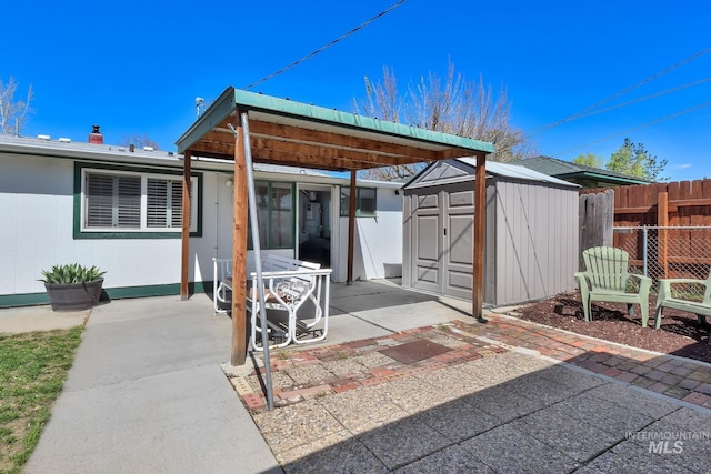 2323 W Lemhi St, Boise, ID 83705 - view of patio with fence, an outdoor structure, and a shed