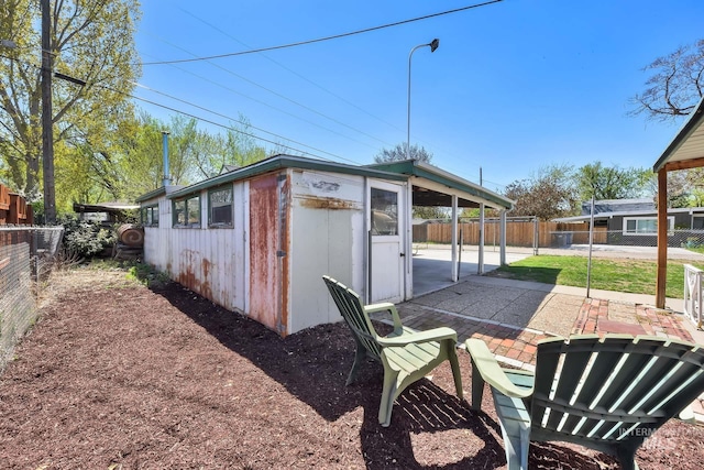 2323 W Lemhi St, Boise, ID 83705 - view of outbuilding with an outdoor structure and a fenced backyard