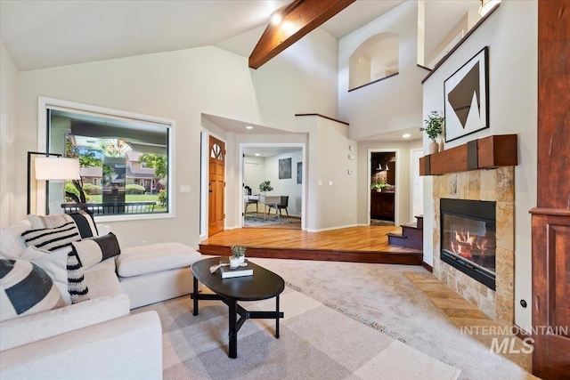 1814 E Spinnaker Ct, Boise, ID 83706 - living area with light colored carpet, a fireplace, and lofted ceiling