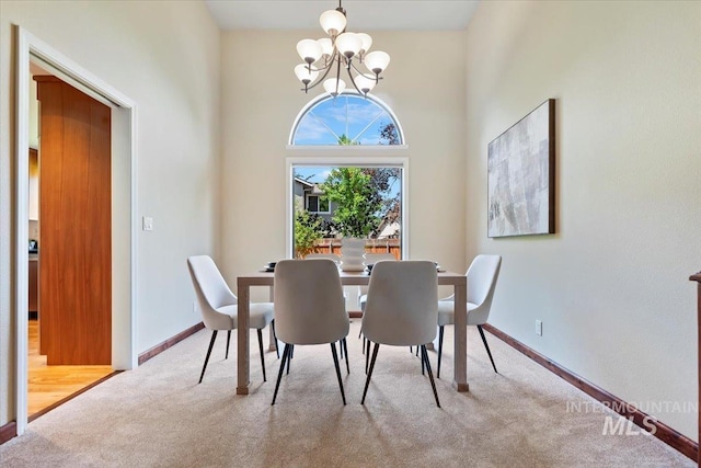 1814 E Spinnaker Ct, Boise, ID 83706 - dining room with carpet, a chandelier, and baseboards