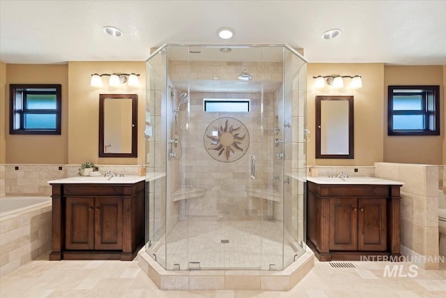 1814 E Spinnaker Ct, Boise, ID 83706 - bathroom with two vanities, a shower stall, and a bath