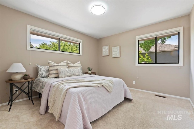 1814 E Spinnaker Ct, Boise, ID 83706 - bedroom featuring light colored carpet and baseboards