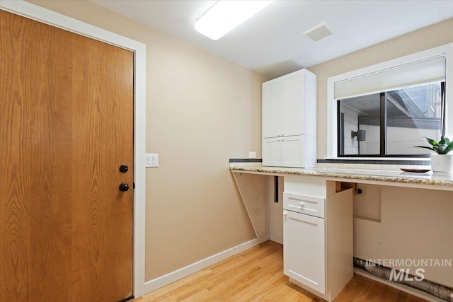 1814 E Spinnaker Ct, Boise, ID 83706 - unfurnished office featuring light wood-type flooring, baseboards, and built in study area