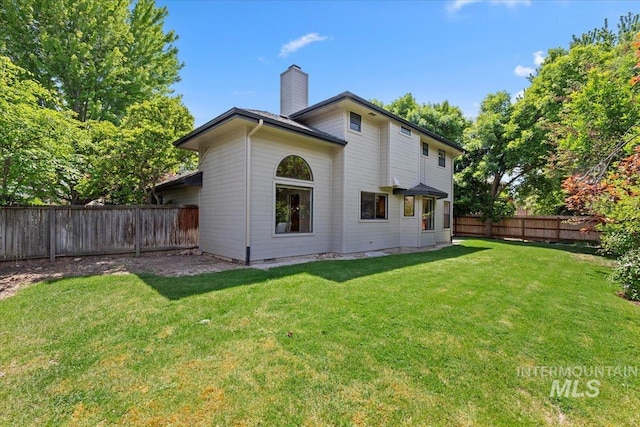 1814 E Spinnaker Ct, Boise, ID 83706 - rear view of house featuring a chimney