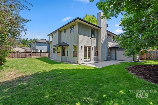 1814 E Spinnaker Ct, Boise, ID 83706 - back of property with a chimney and a patio area