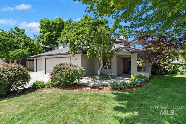 1814 E Spinnaker Ct, Boise, ID 83706 - obstructed view of property featuring a garage, a front yard, and driveway