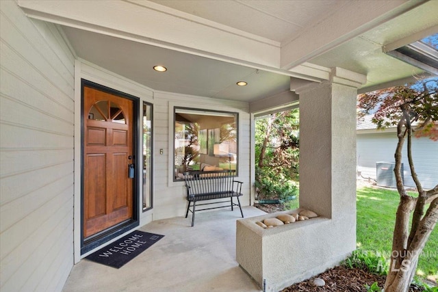1814 E Spinnaker Ct, Boise, ID 83706 - doorway to property featuring cooling unit and covered porch