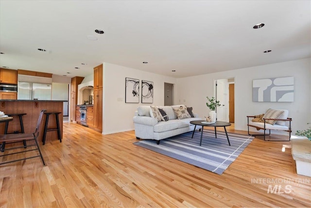 1814 E Spinnaker Ct, Boise, ID 83706 - living area featuring light wood-type flooring and baseboards