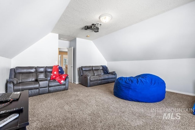 interior space featuring lofted ceiling, carpet floors, and a textured ceiling