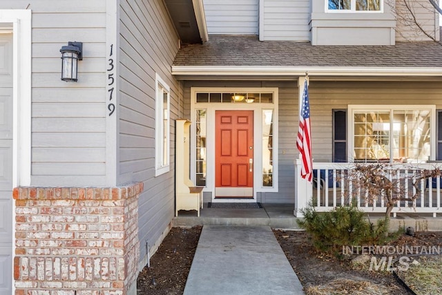 entrance to property featuring covered porch