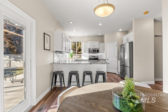 dining room featuring dark wood-type flooring