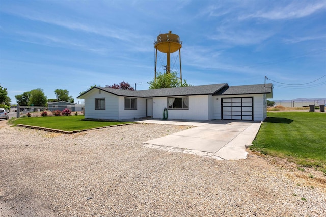 101 Patton St, Marsing, ID 83639 - view of front facade with an attached garage and driveway