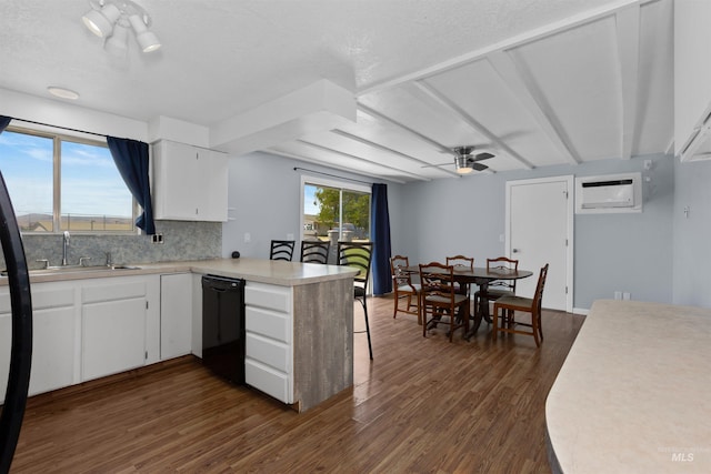 101 Patton St, Marsing, ID 83639 - kitchen with black dishwasher, a peninsula, a sink, light countertops, and backsplash