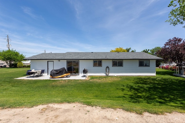 101 Patton St, Marsing, ID 83639 - back of house with a patio area and a lawn