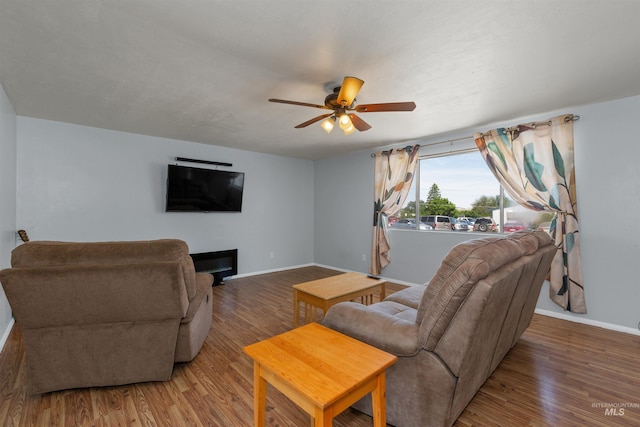 101 Patton St, Marsing, ID 83639 - living area featuring ceiling fan, baseboards, and wood finished floors