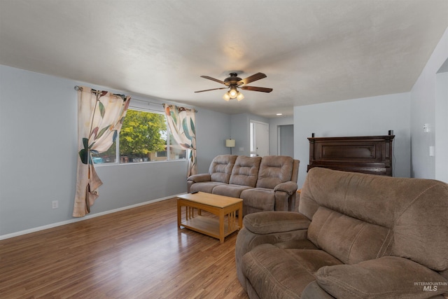 101 Patton St, Marsing, ID 83639 - living area featuring ceiling fan, baseboards, and light wood-style floors