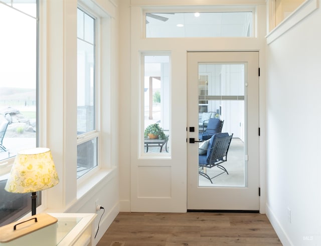 doorway to outside with wood-type flooring and french doors