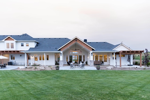 back of property with central AC, ceiling fan, a yard, and a patio