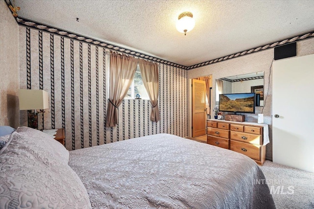 carpeted bedroom with a textured ceiling