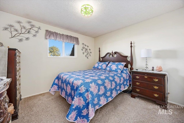 carpeted bedroom featuring a textured ceiling