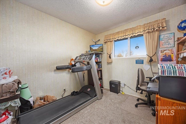 home office with light carpet and a textured ceiling