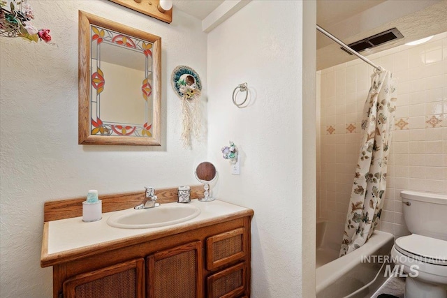 full bathroom with toilet, vanity, and shower / bathtub combination with curtain