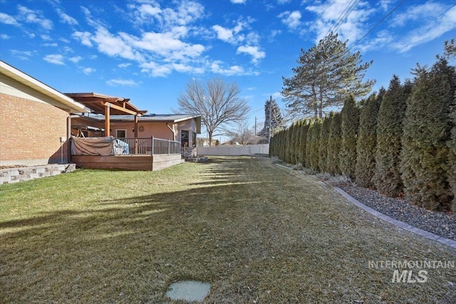 view of yard with a wooden deck