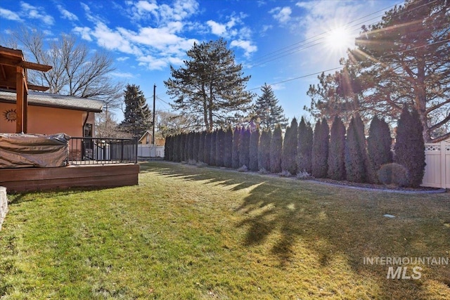 view of yard with a deck