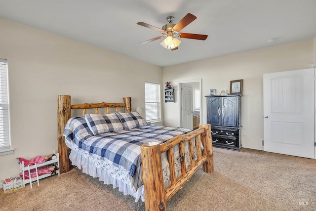 carpeted bedroom featuring a ceiling fan